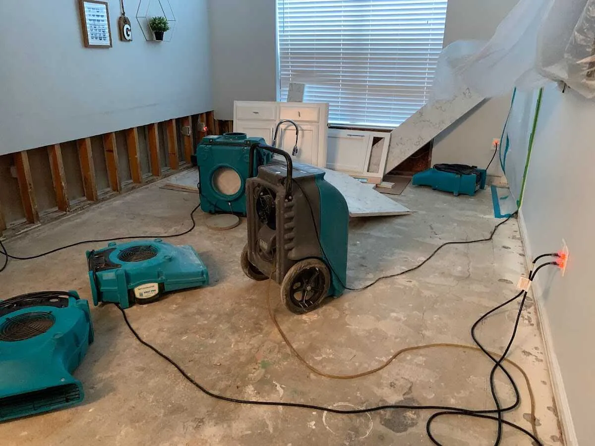 Dehumidifier in flood-cut room for Water Damage Restoration in Graham